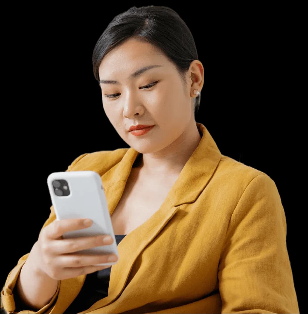 A woman looking at her cell phone