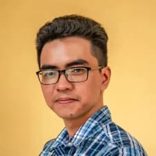 A man wearing glasses and a plaid shirt.