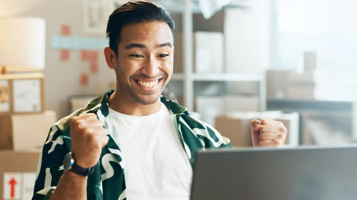 Business owner celebrating success with PayMongo