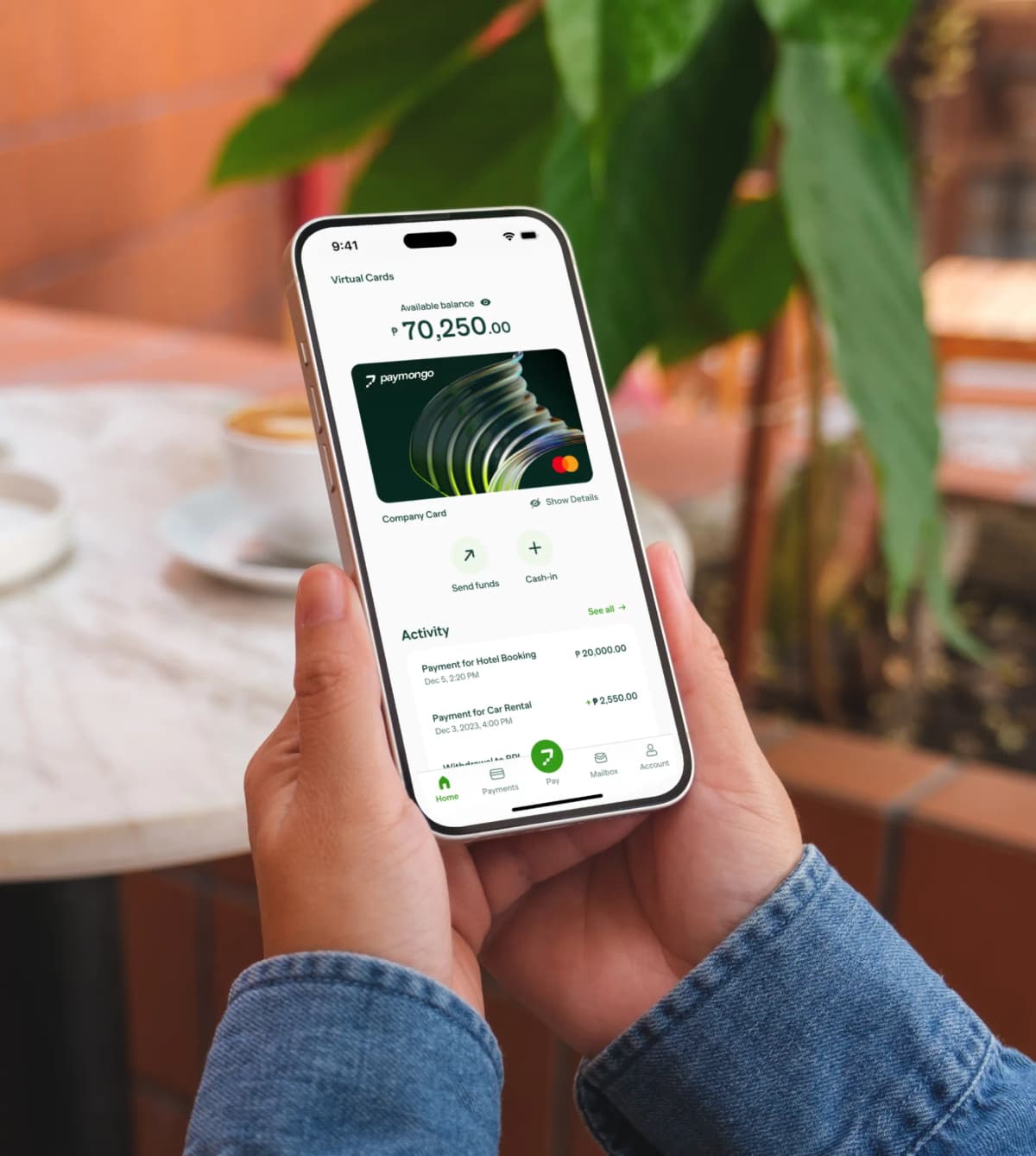 A person holding a cell phone in their hand