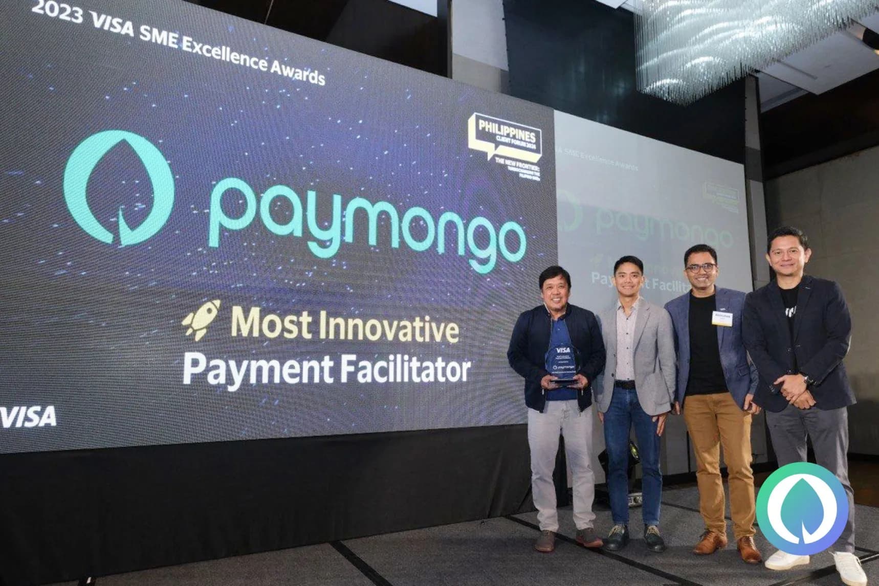 A group of people standing next to each other on a stage.