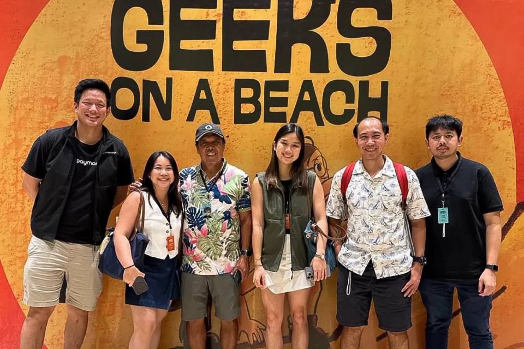 A group of people at a beach event.