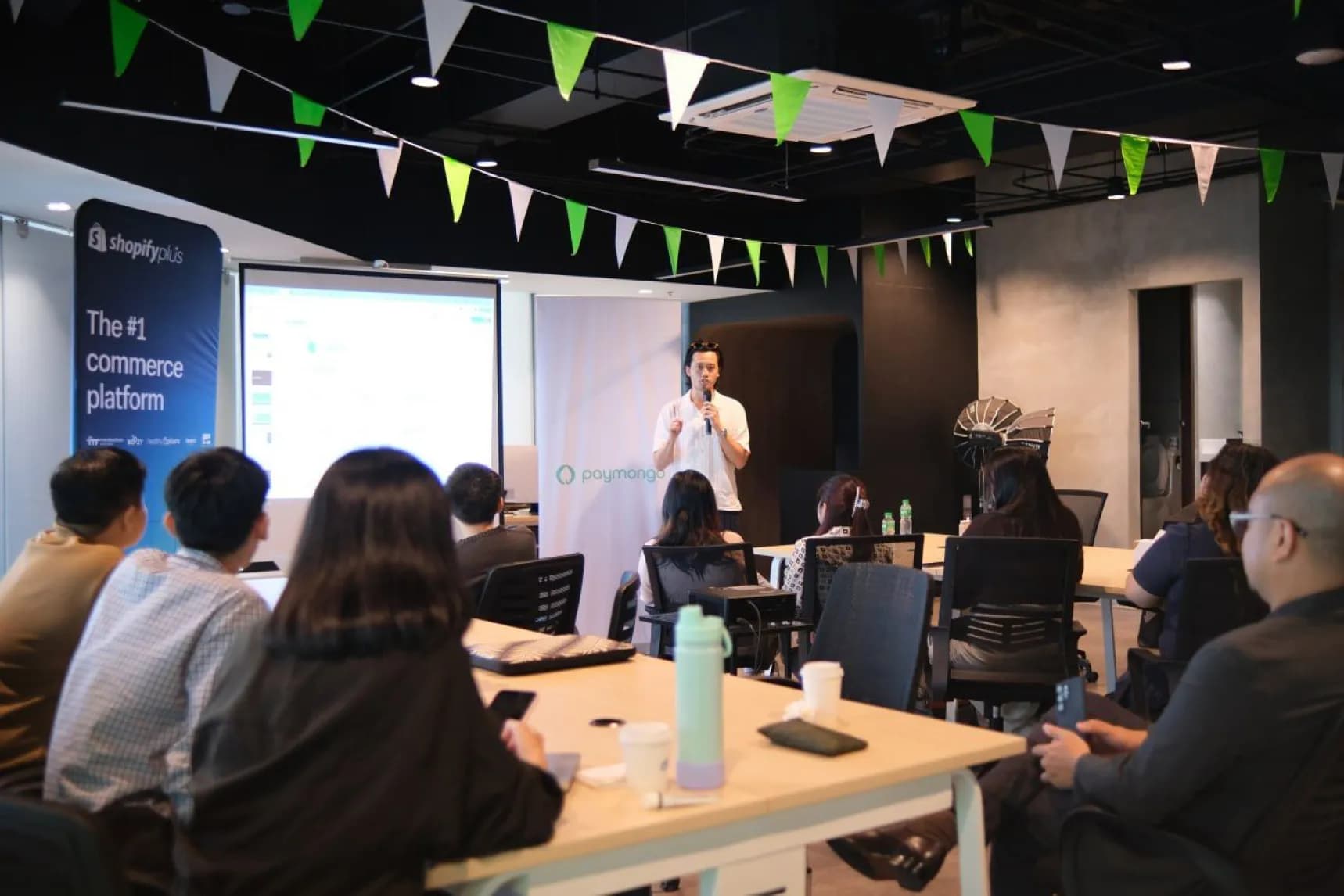 A man giving a presentation to a group of people.